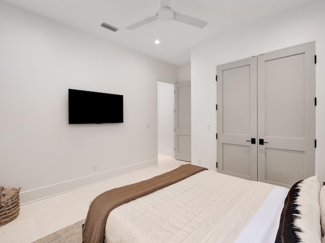 bedroom with ceiling fan and a closet