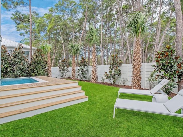 view of yard featuring a fenced in pool