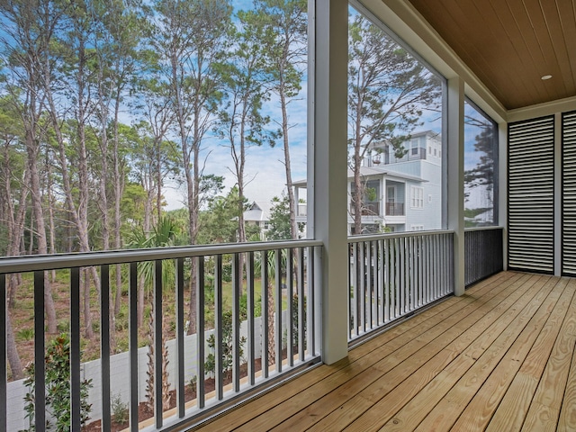 unfurnished sunroom with wooden ceiling