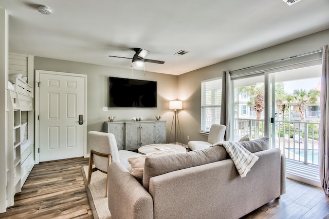 living room featuring a wealth of natural light, ceiling fan, and hardwood / wood-style floors