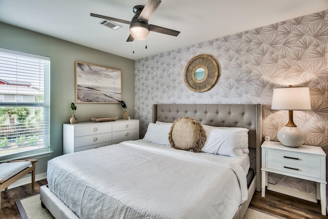 bedroom featuring ceiling fan and dark hardwood / wood-style flooring