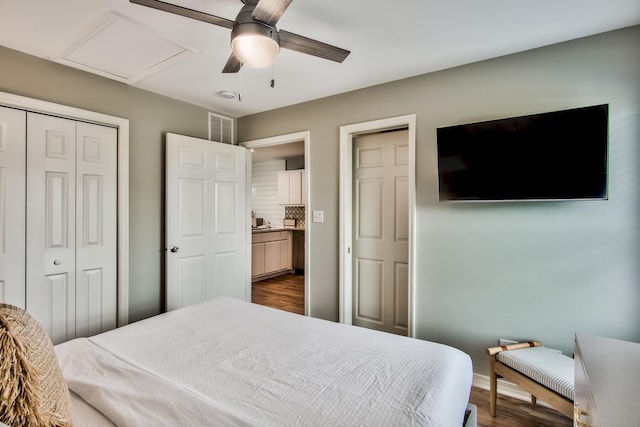 bedroom with dark wood-type flooring, a closet, and ceiling fan