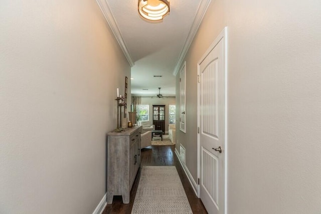 hallway featuring dark hardwood / wood-style flooring and ornamental molding