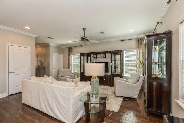 living room featuring ornamental molding, ceiling fan, and dark hardwood / wood-style floors