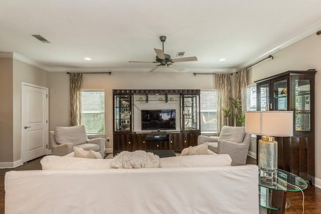 living room with ceiling fan, dark hardwood / wood-style floors, and crown molding