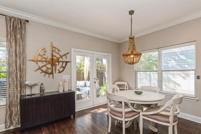 dining area with crown molding, french doors, and dark wood-type flooring