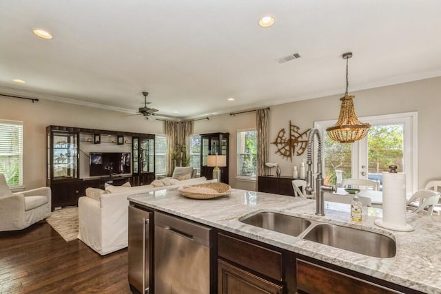 kitchen featuring dark brown cabinetry, sink, dishwasher, and light stone counters