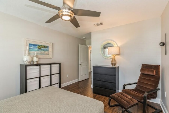 bedroom with dark hardwood / wood-style floors and ceiling fan