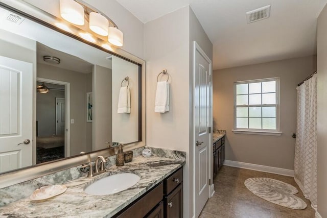 bathroom with vanity and tile patterned floors