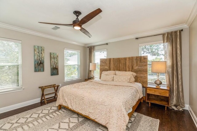 bedroom with ornamental molding, dark hardwood / wood-style flooring, and ceiling fan