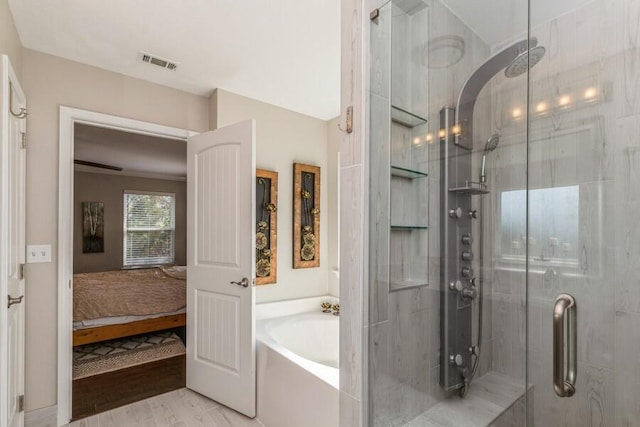 bathroom with shower with separate bathtub and hardwood / wood-style floors