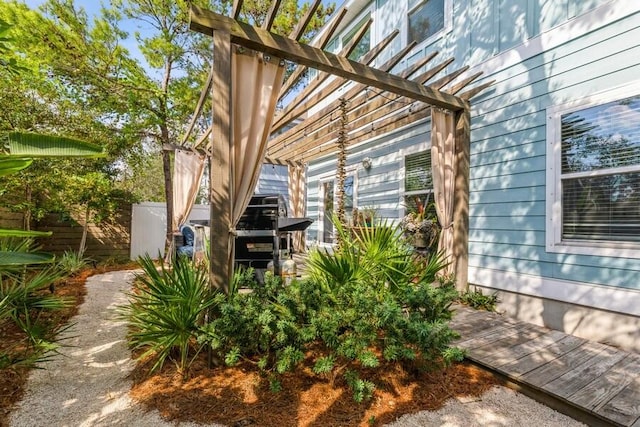 view of property exterior featuring a pergola