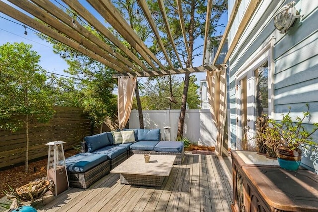 deck with an outdoor hangout area and a pergola