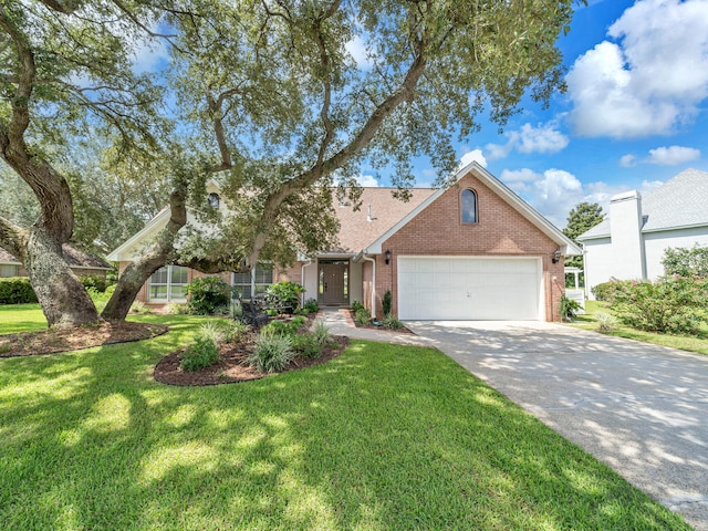 view of front of home with a garage and a front yard