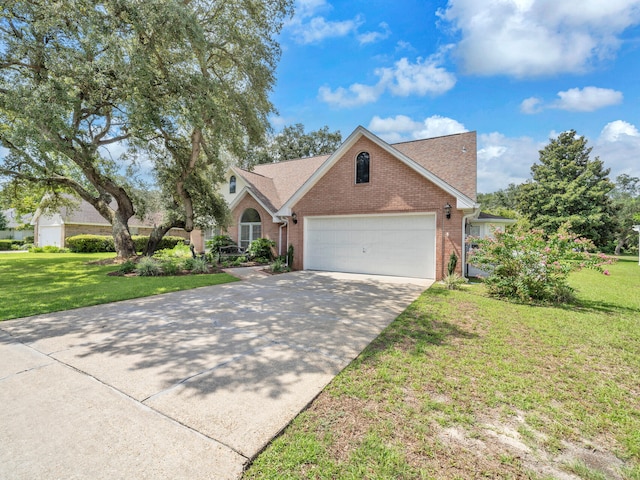 view of front facade with a garage and a front lawn