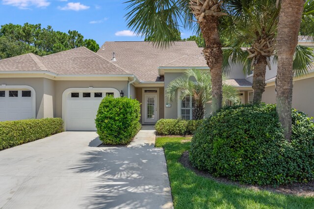 ranch-style home with a garage