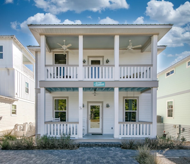 view of front of home with ceiling fan, a porch, and a balcony