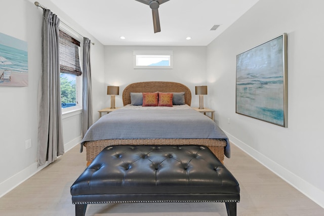 bedroom with ceiling fan and light hardwood / wood-style floors