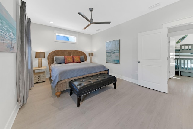 bedroom with ceiling fan and light wood-type flooring