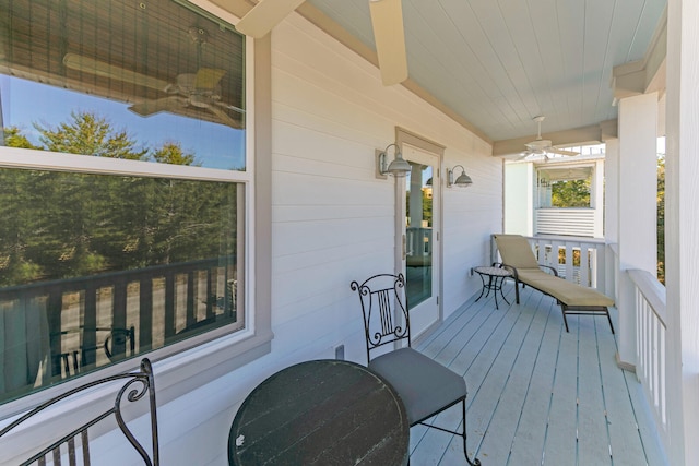 balcony featuring ceiling fan and a porch