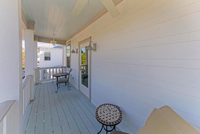 wooden terrace with ceiling fan