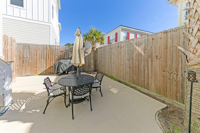 view of patio featuring a grill