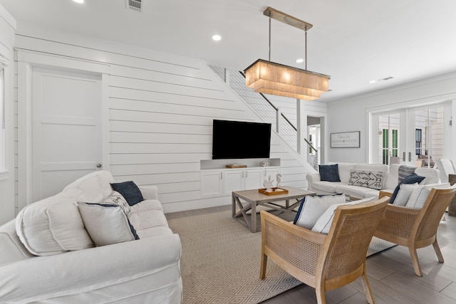 living room featuring light wood-type flooring and french doors