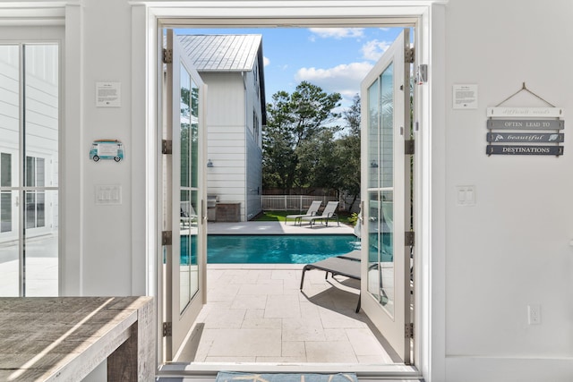 view of swimming pool featuring a patio area