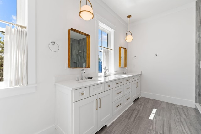 bathroom featuring double vanity and crown molding