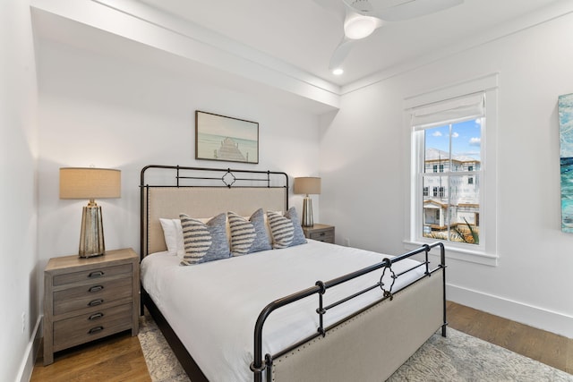 bedroom with hardwood / wood-style flooring and ceiling fan