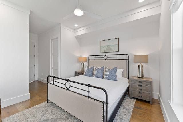 bedroom featuring ceiling fan and hardwood / wood-style floors