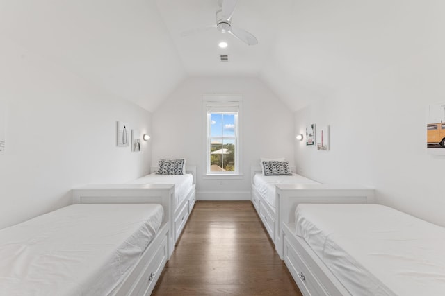 bedroom with dark wood-type flooring, ceiling fan, and vaulted ceiling