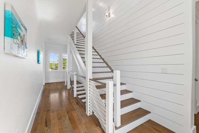 staircase with wood-type flooring