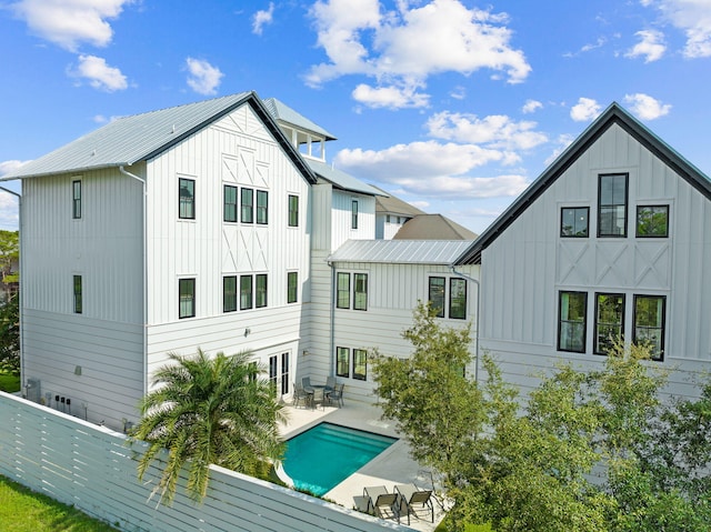 rear view of property featuring a patio area