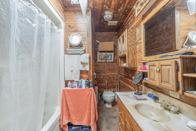 full bathroom featuring vanity, wooden ceiling, toilet, and wooden walls