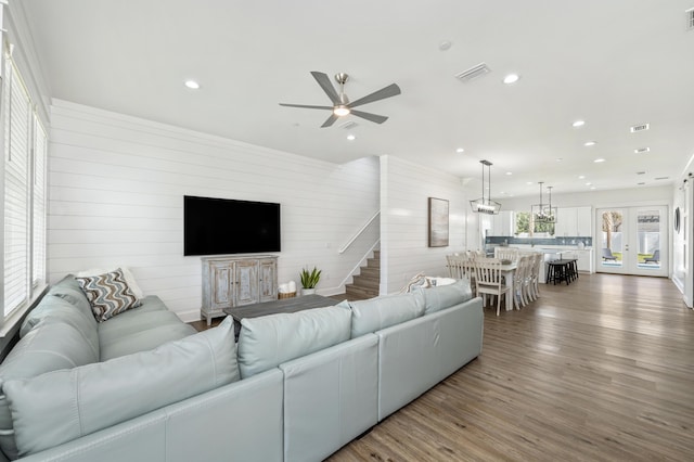 living room with visible vents, ceiling fan, stairway, wood finished floors, and recessed lighting