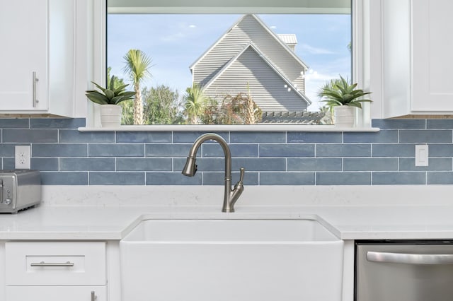 details with light countertops, decorative backsplash, white cabinets, a sink, and dishwasher