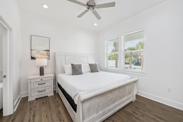 bedroom featuring dark wood-style floors, baseboards, and recessed lighting