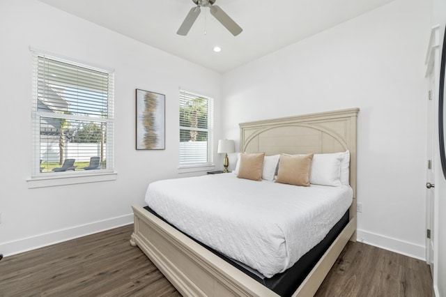 bedroom with baseboards, dark wood finished floors, a ceiling fan, and recessed lighting