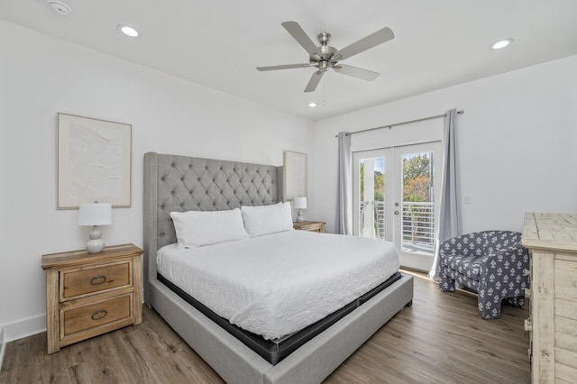 bedroom featuring recessed lighting, access to outside, wood finished floors, and french doors