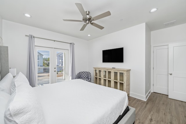 bedroom with access to exterior, light wood-type flooring, visible vents, and recessed lighting