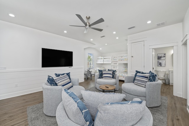 living area with vaulted ceiling, ceiling fan, dark wood-type flooring, and visible vents