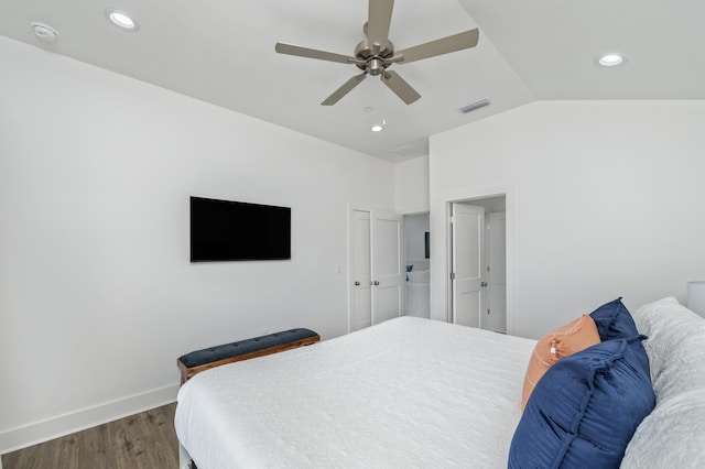 bedroom featuring dark wood-style floors, recessed lighting, visible vents, vaulted ceiling, and baseboards