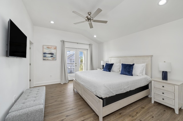 bedroom featuring access to exterior, vaulted ceiling, french doors, light wood-style floors, and recessed lighting