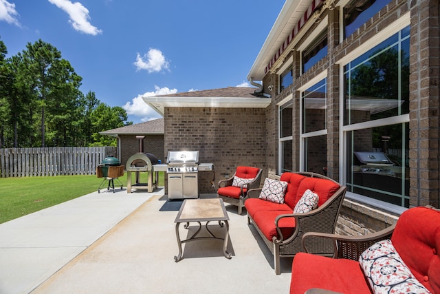 view of patio with a grill and an outdoor living space