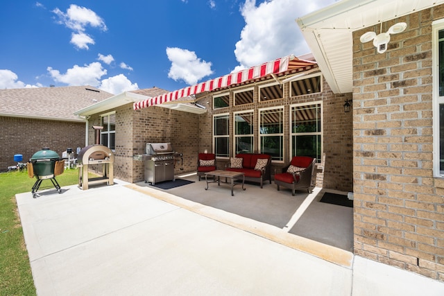 view of patio / terrace featuring an outdoor living space and grilling area