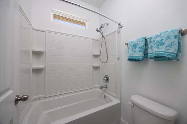 bathroom featuring bathing tub / shower combination and toilet