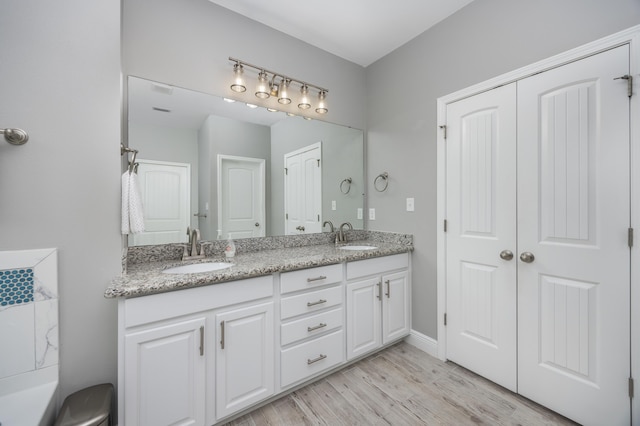 bathroom featuring vanity and hardwood / wood-style flooring