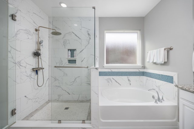 bathroom featuring independent shower and bath and vanity