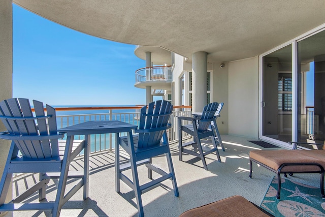 view of patio featuring a balcony